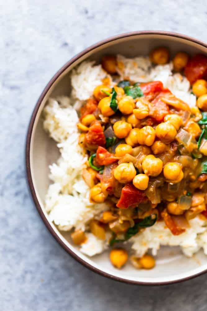 Chickpea coconut curry over rice in a bowl