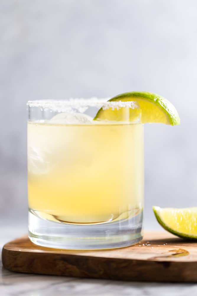 Margarita in a clear glass with lime wedge garnish.