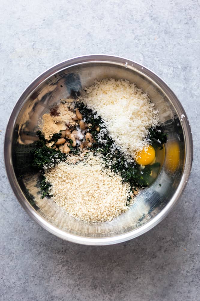 ingredients for white bean and kale burgers in a silver bowl