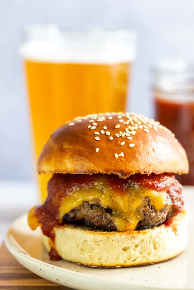 Closeup of BBQ burger with cheese on a bun