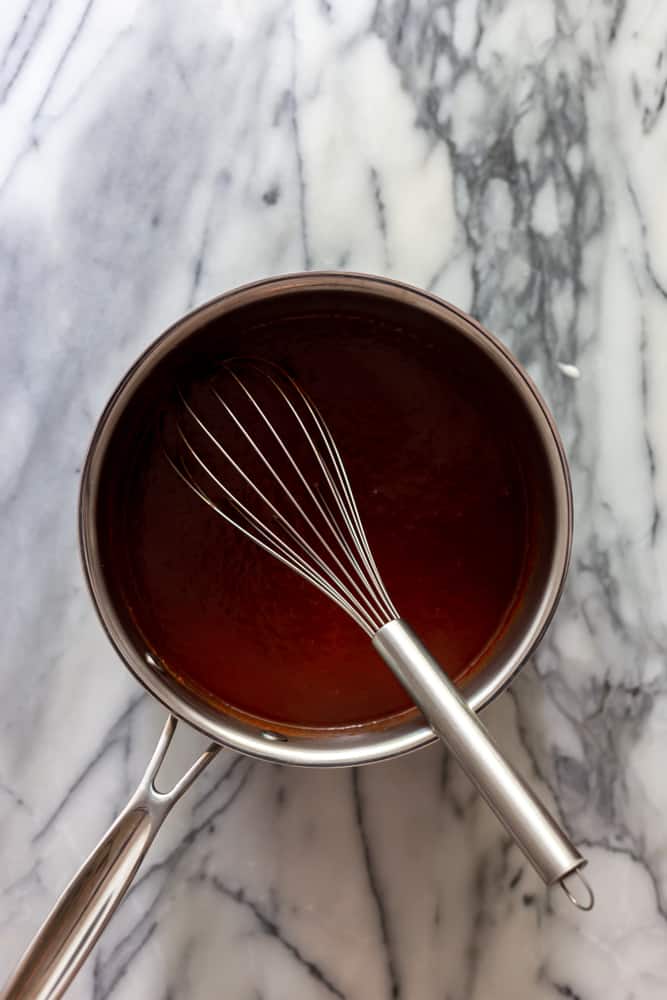 BBQ Sauce in a sauce pan with a whisk