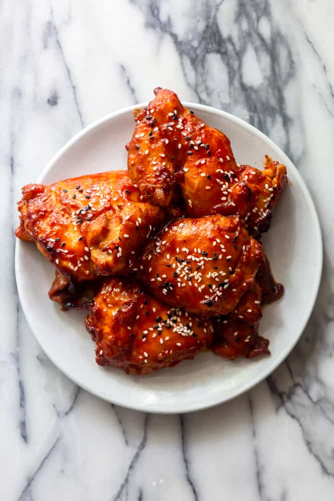 Korean Chicken Thighs on a white plate