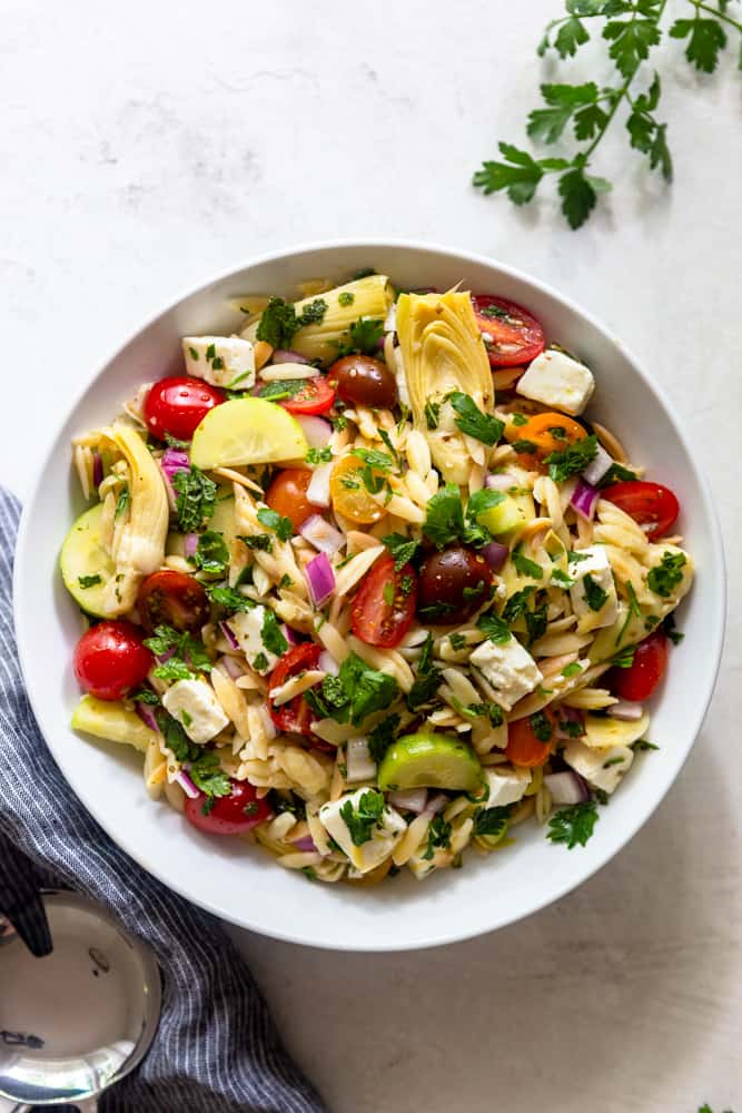 Mediterranean Orzo Salad in a white bowl