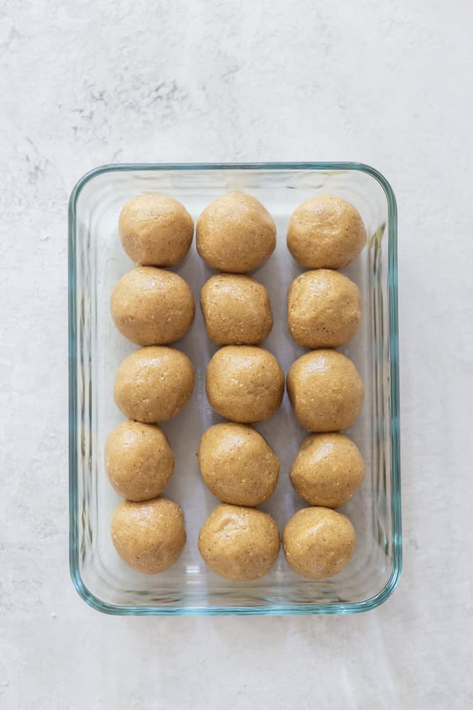 Peanut butter balls in a glass container