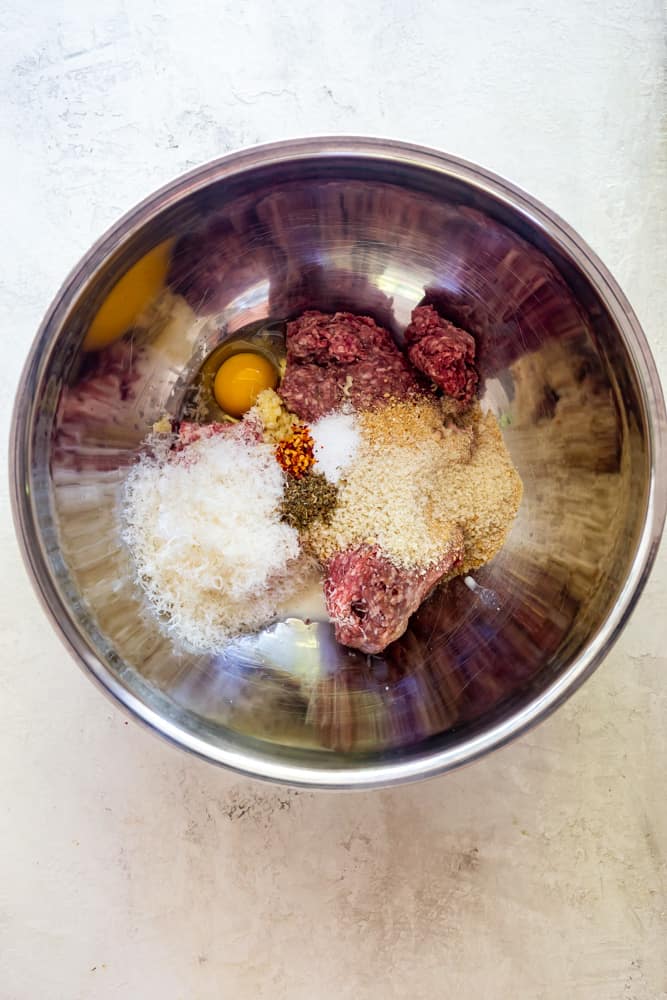 Ingredients for meatballs in a bowl