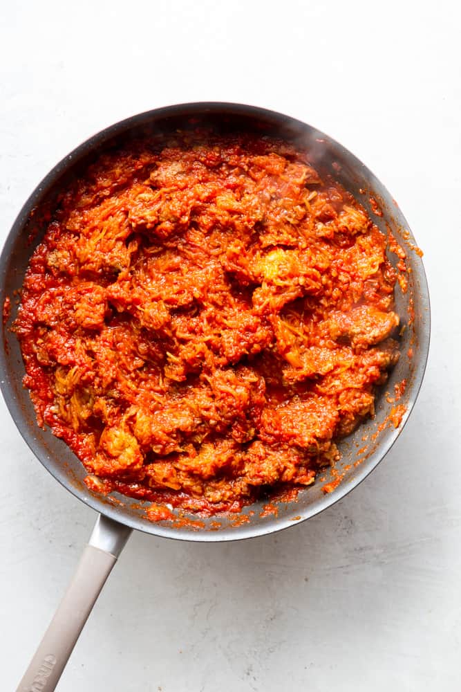 Spaghetti Squash mixed with sauce in a sauce pan