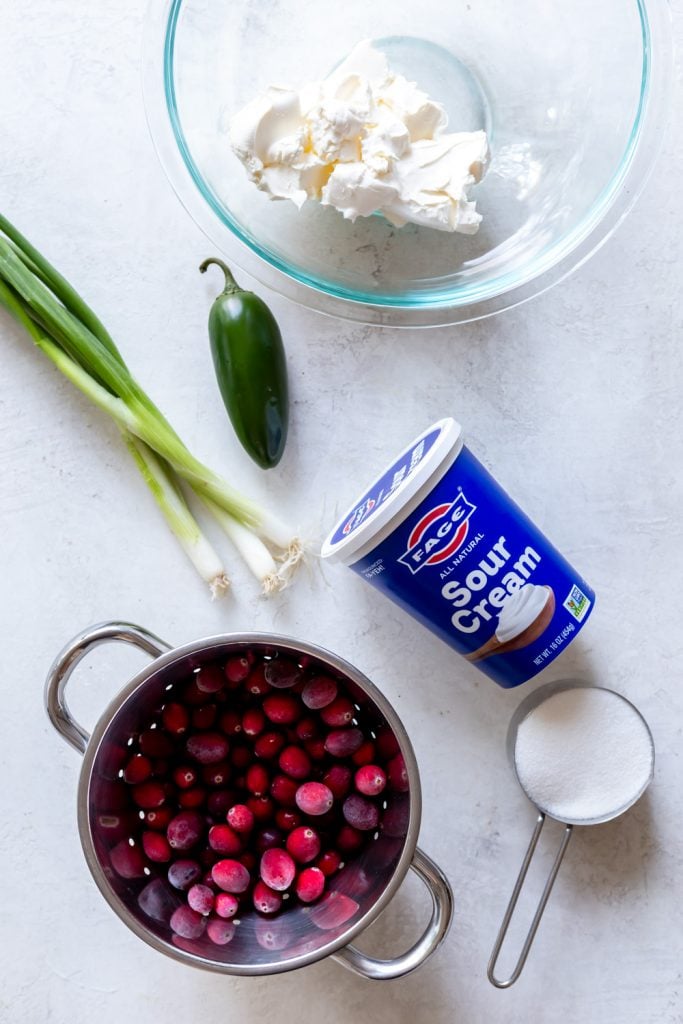 ingredients for cranberry jalapeno dip - cranberries, sour cream, sugar, green onions, jalapeno