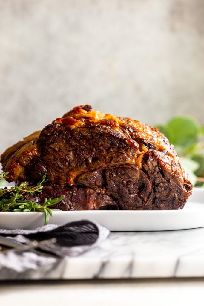 Whole Slow Roasted Prime Rib after cooking with browned exterior.