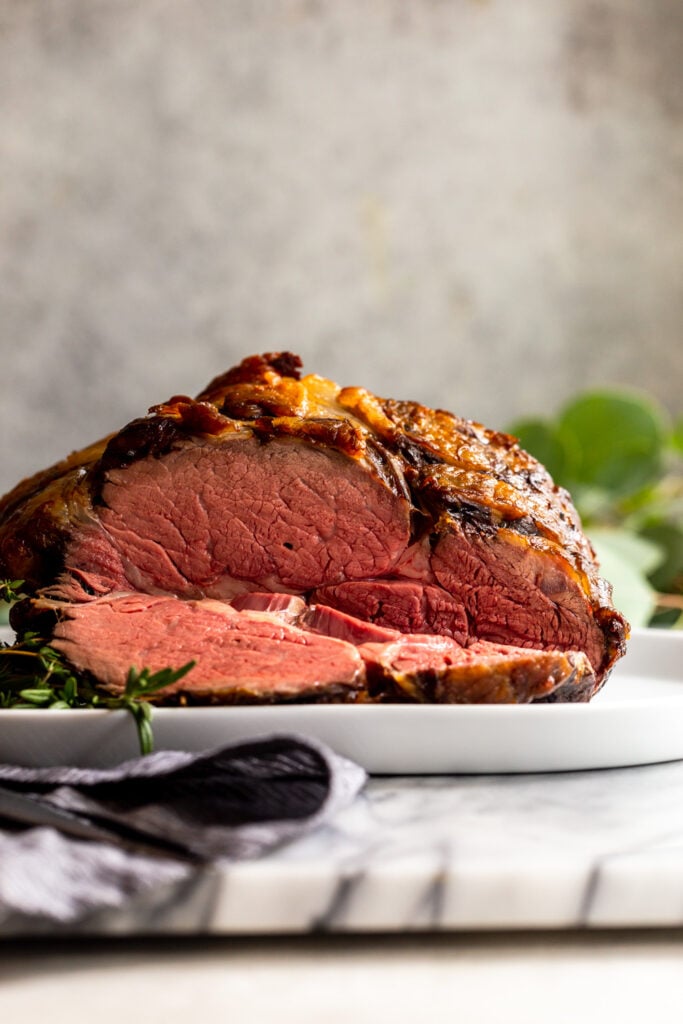 Slow ROasted prime rib sliced showing pink interior.