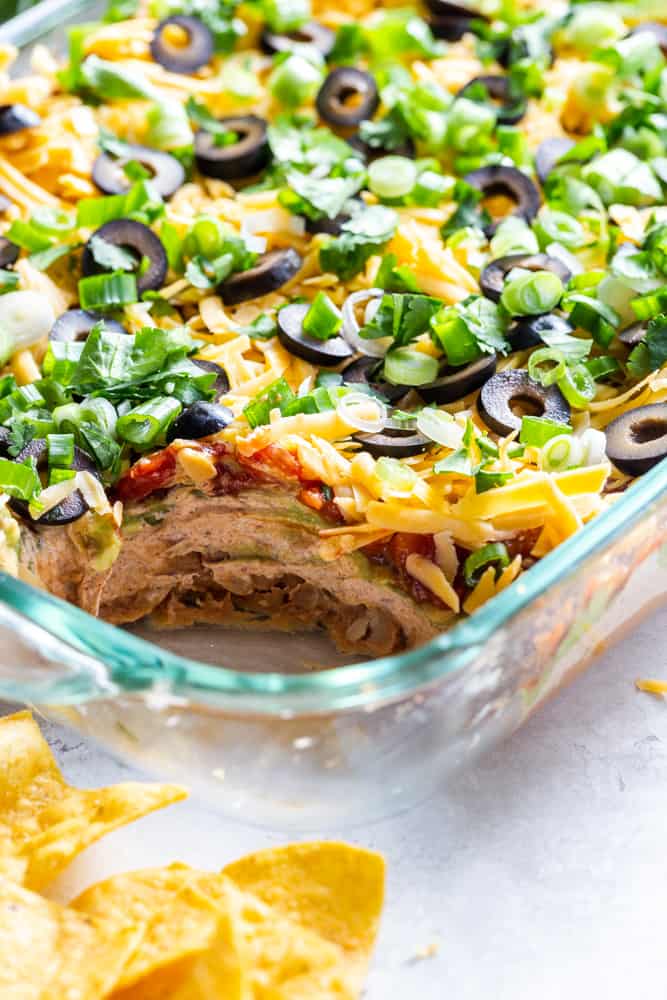 Closeup of seven layer dip in a glass baking dish