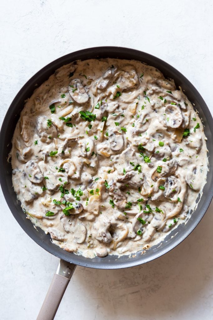 Creamy beef stroganoff in a large sauté pan