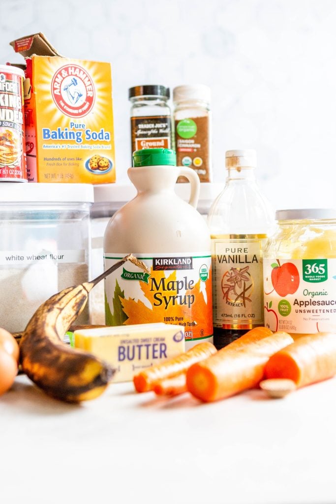 Ingredients for Banana Carrot Muffins - ripe bananas, carrots, eggs, maple syrup, pure vanilla extract, unsweetened applesauce, white wheat flour, baking powder, baking soda, ground ginger, ground cinnamon, nutmeg