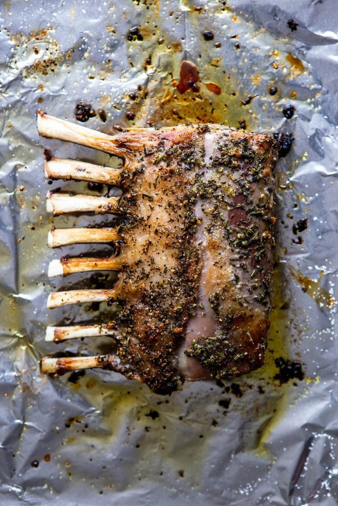 Garlic Herb Roasted Rack of Lamb on a baking sheet.