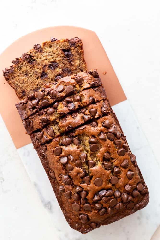 Overhead view of moist chocolate chip banana bread cut into slices