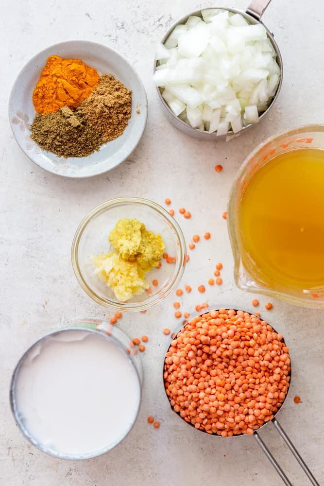 Ingredients for red lentil dal - diced onions, broth, red lentils, coconut milk, ginger, garlic, spices (turmeric, coriander, cumin.)