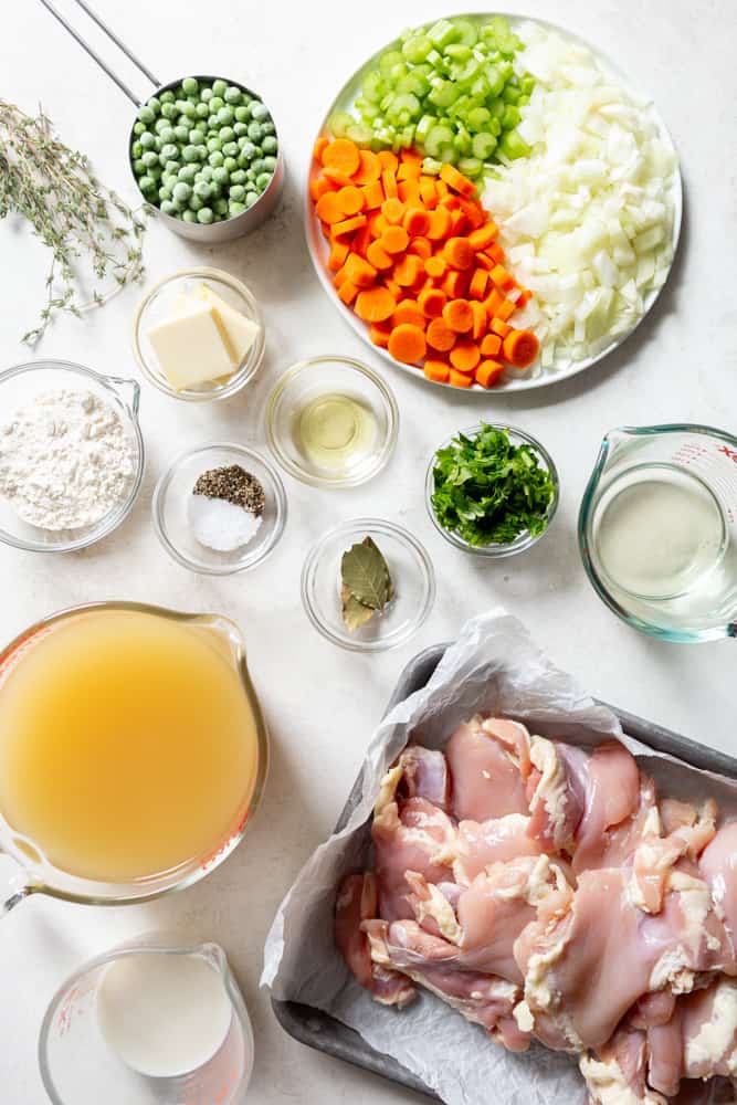 Ingredients for chicken and dumplings: Chicken, milk, chicken broth, wine, herbs, salt, pepper, oil, flour, butter, carrots, celery, onions, peas