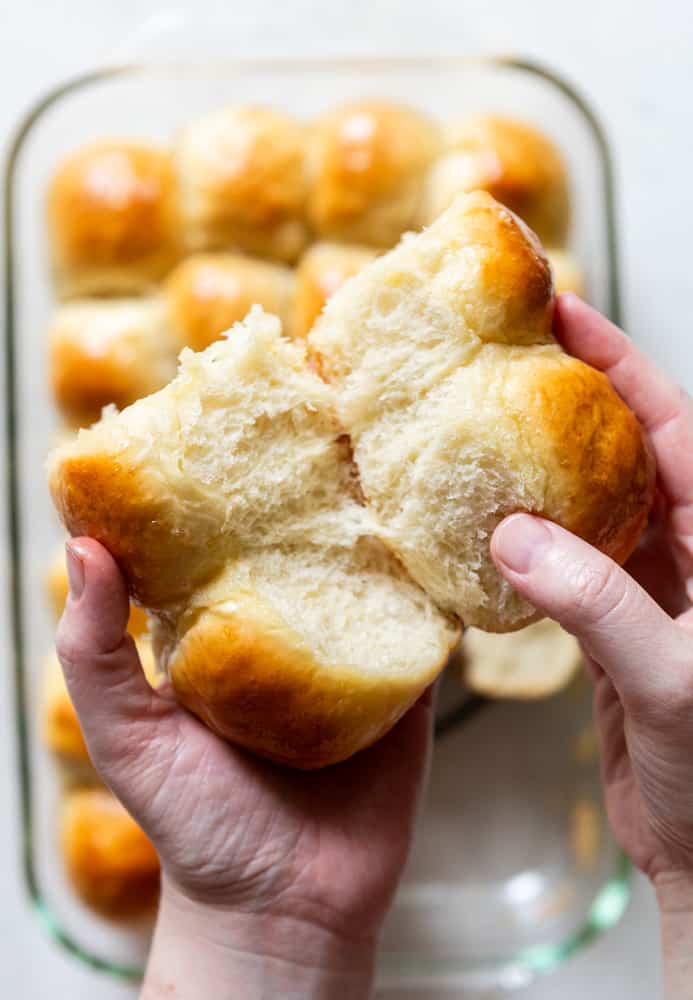 Soft and Fluffy Dinner Rolls being pulled apart.