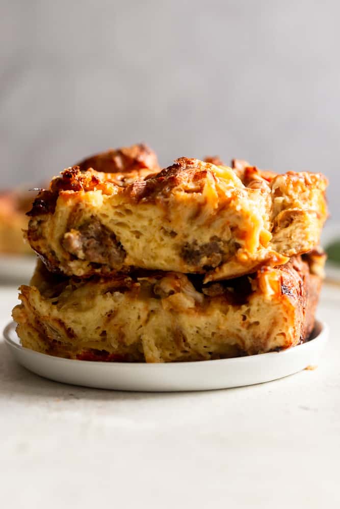 Slices of make ahead breakfast croissant casserole on a plate. 