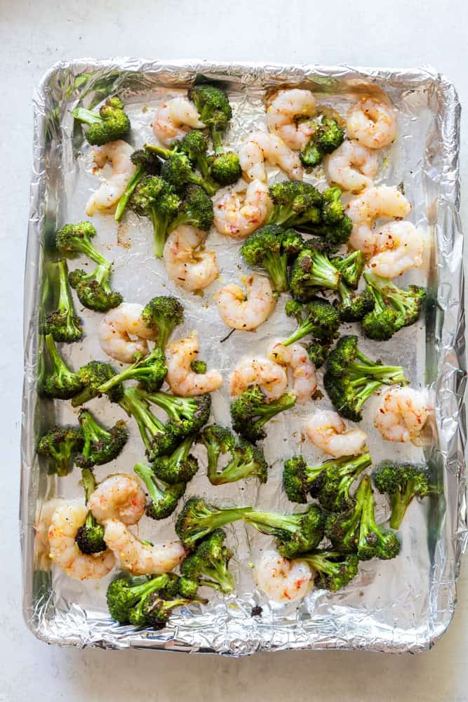 Roasted Shrimp and Broccoli on a sheet pan.