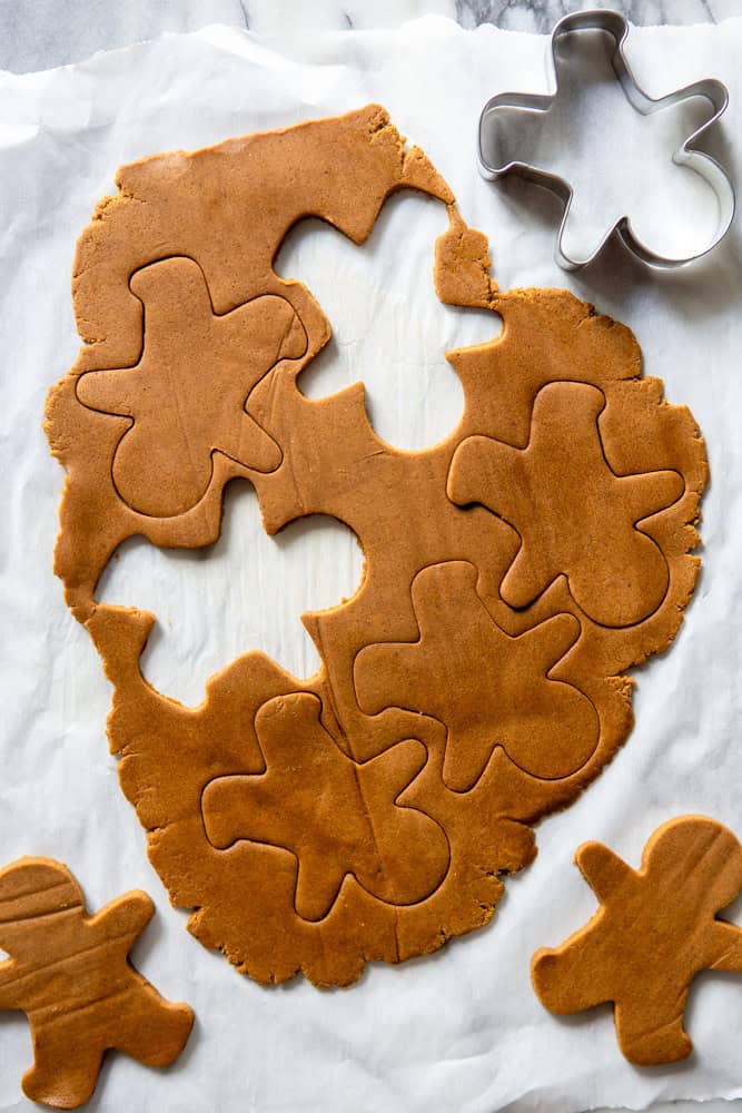 Cutting out the gingerbread dough into shapes.