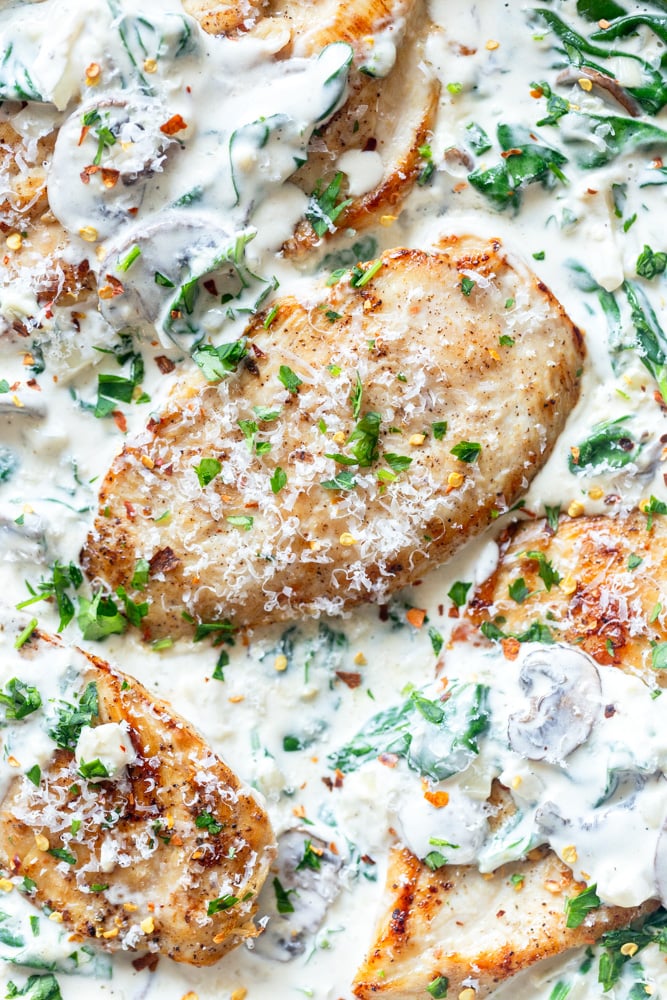 Pan fried chicken in a creamy mushroom spinach sauce.
