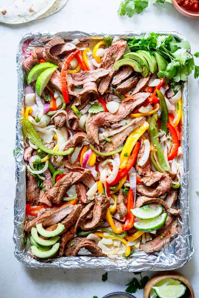 Sheet Pan Steak Fajitas on a foil lined sheet pan.