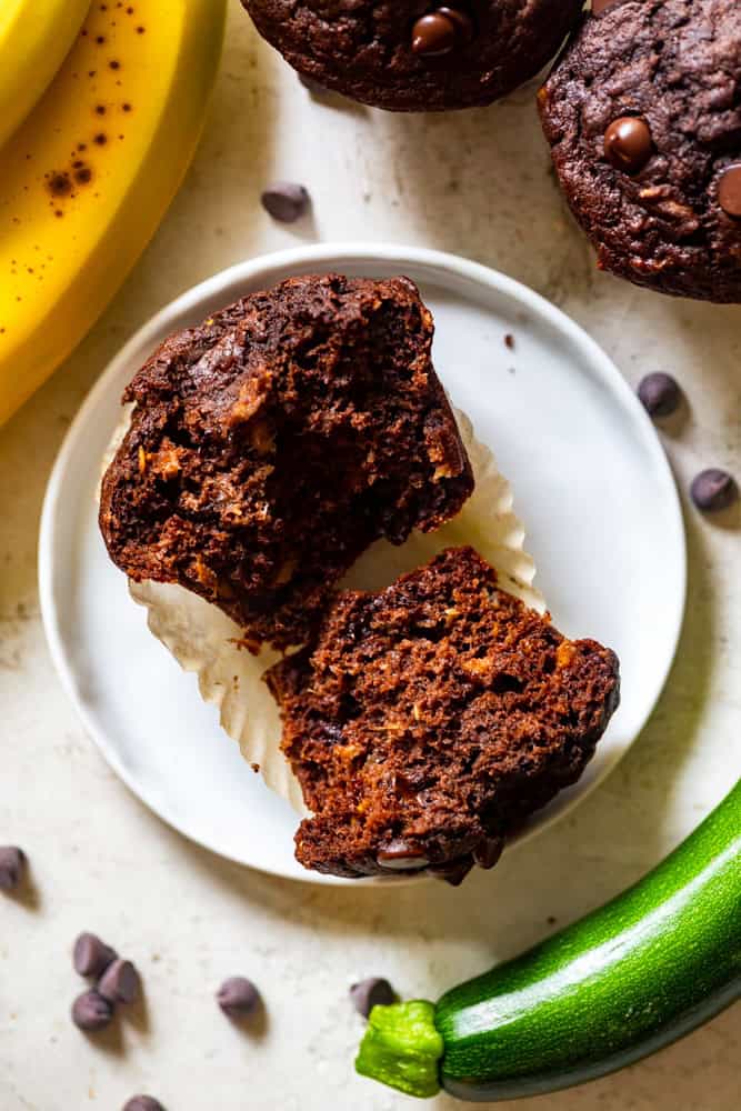 Healthy chocolate zucchini muffin split in half.