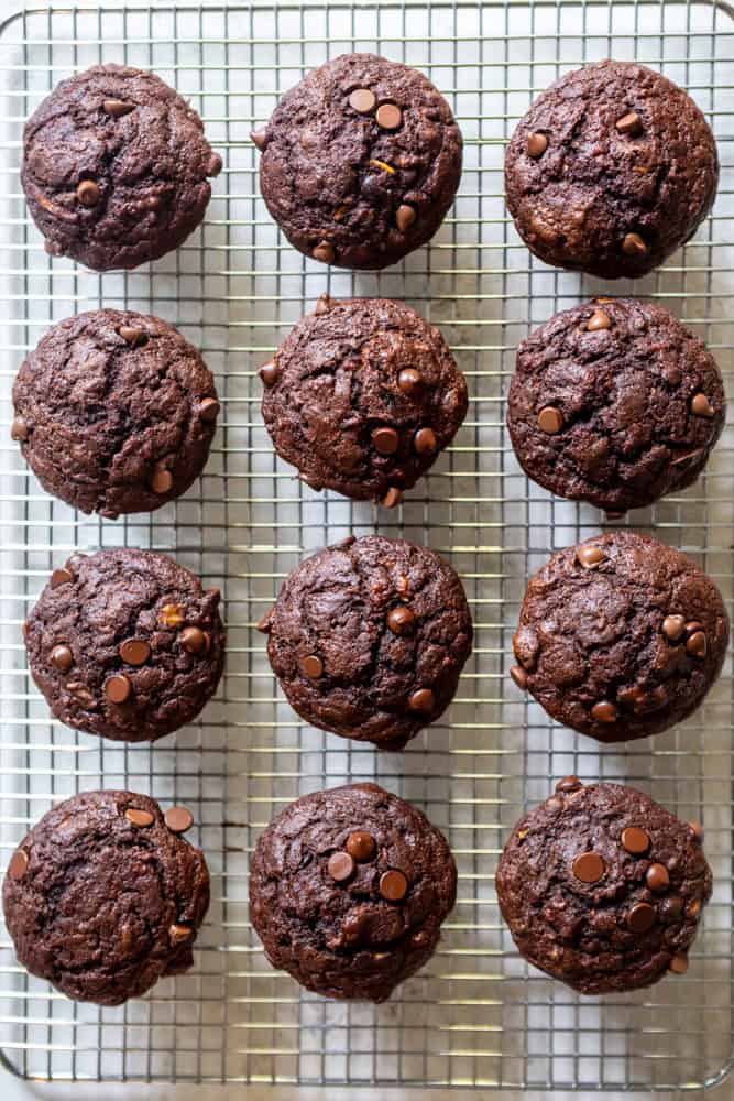 A freshly baked batch of 12 healthy double chocolate zucchini muffins.