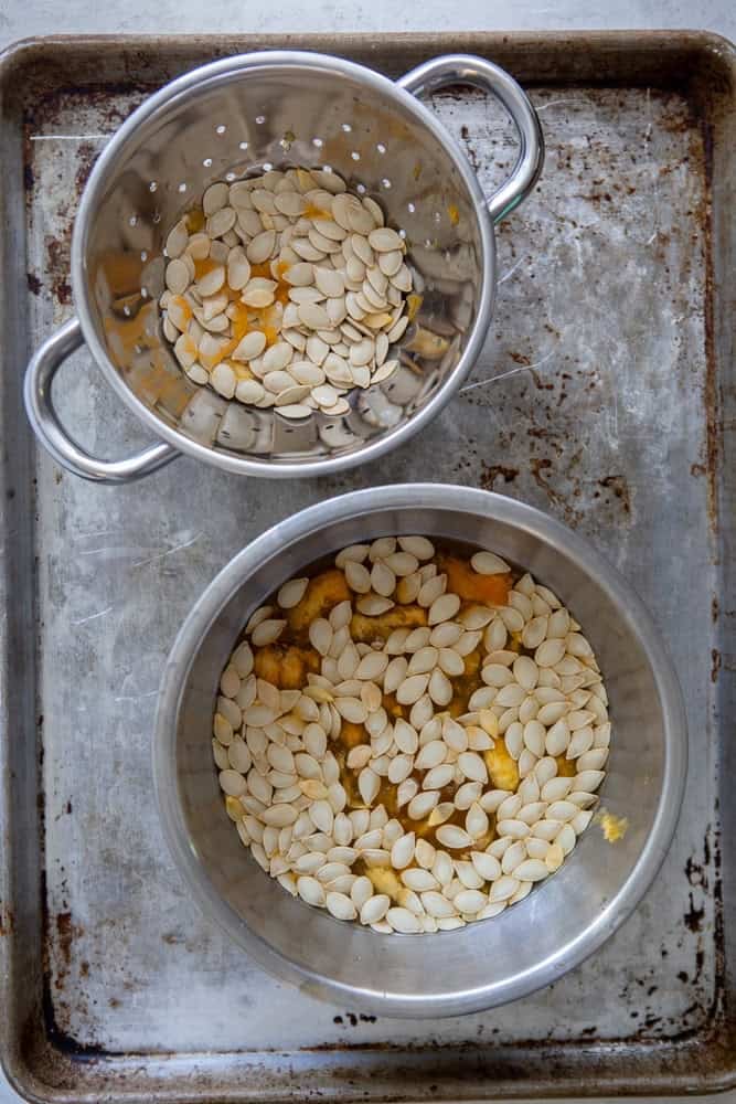 Raw pumpkins seeds being cleaned