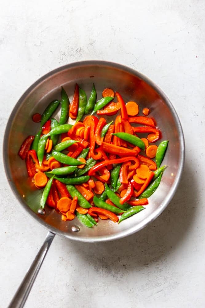 Vegetables being cooked in a pan.
