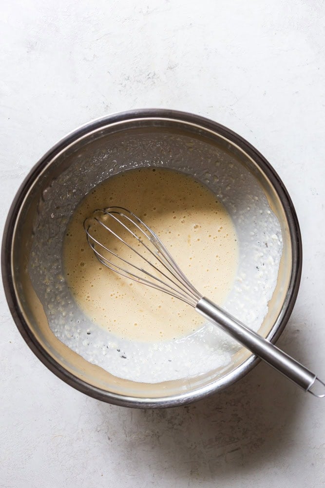Mixing wet ingredients well before adding dry ingredients.